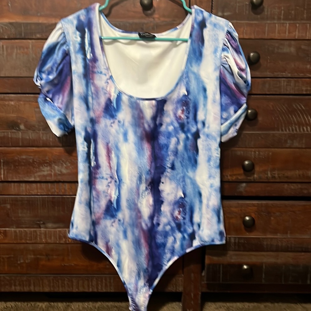 Never worn Bebe bodysuit With snaps.